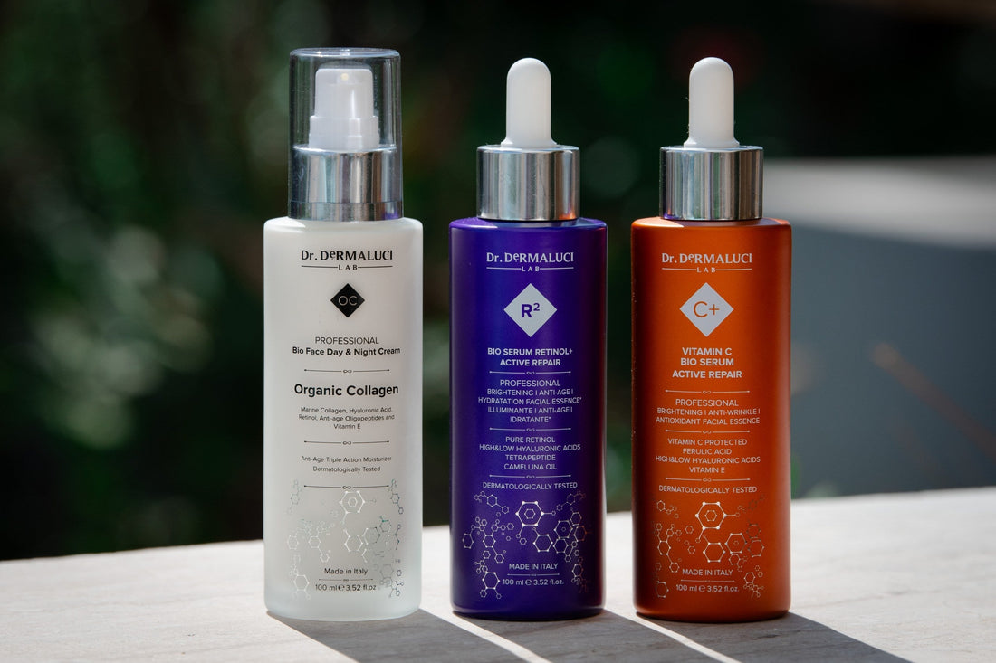 3 Dermaluci Lab organic products: collagen cream, vit C serum and serum retinol, all standing in line on display