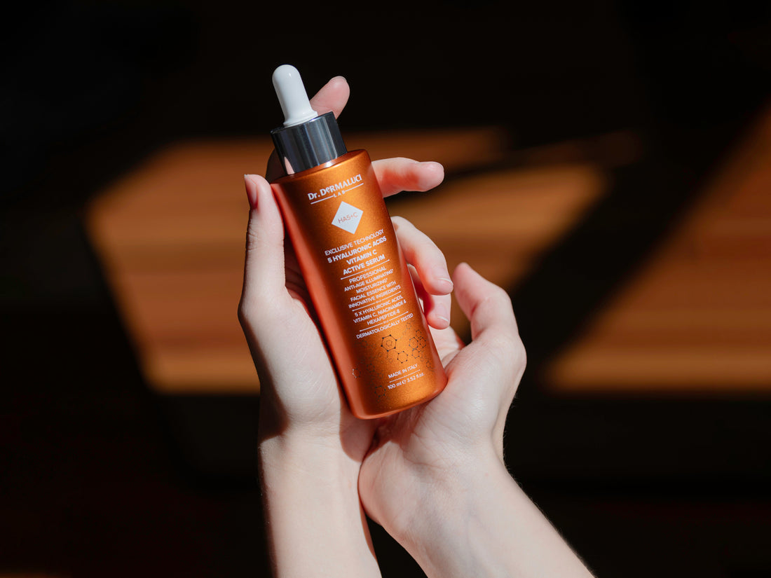 anti aging serum with peptides and 5 hyaluronic acids held in hands